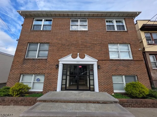 a front view of a house with yard