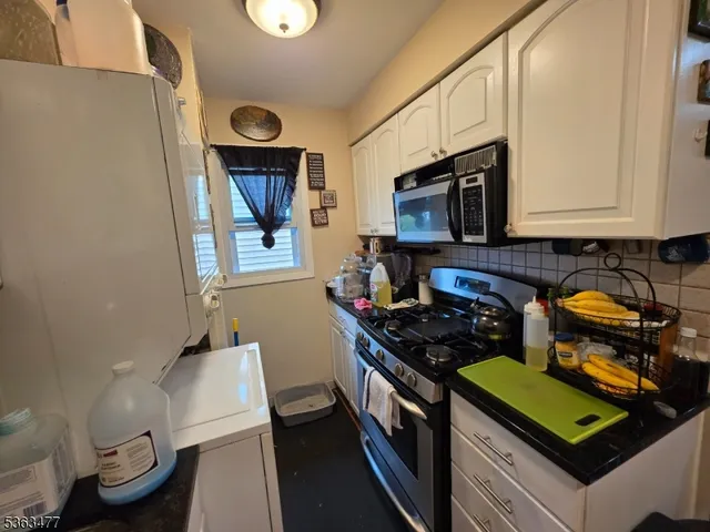 a kitchen with a stove and a microwave