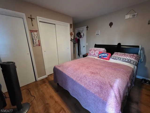 a bed room with a bed and a mirror