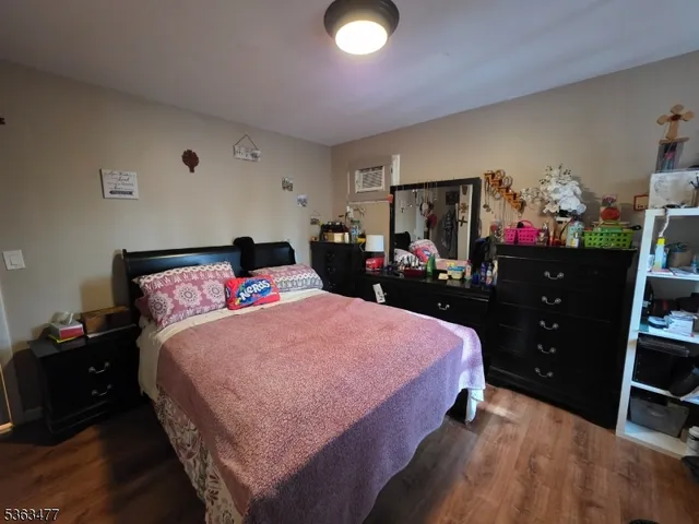 a bedroom with a bed and a closet