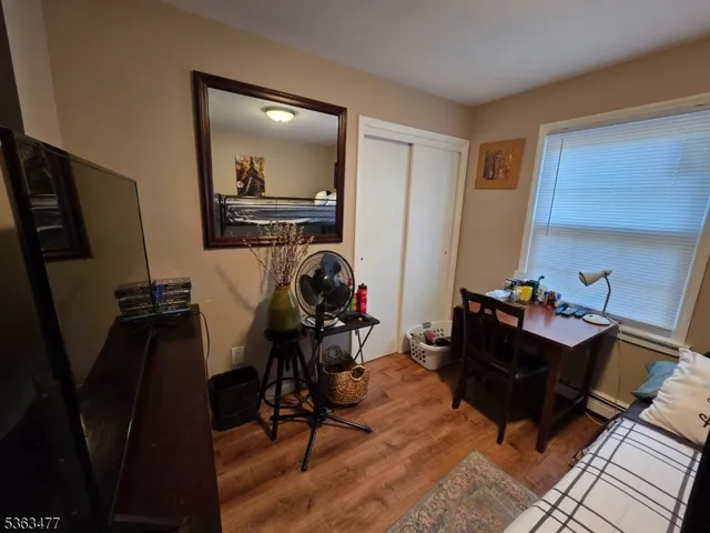 a room with furniture and a wooden floor