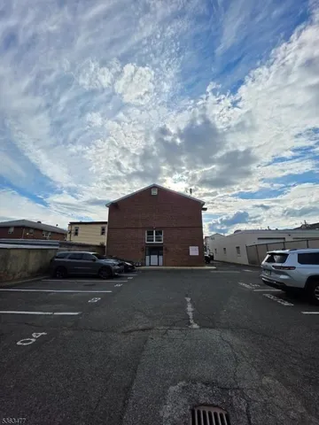a view of a car parked in front of a house