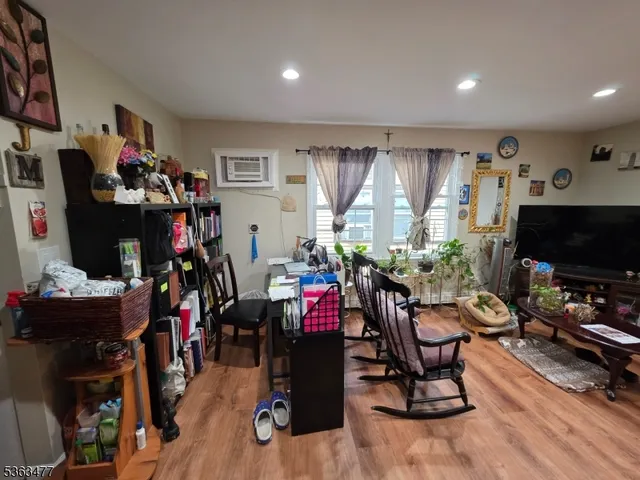 a living room with lots of furniture and gym equipment