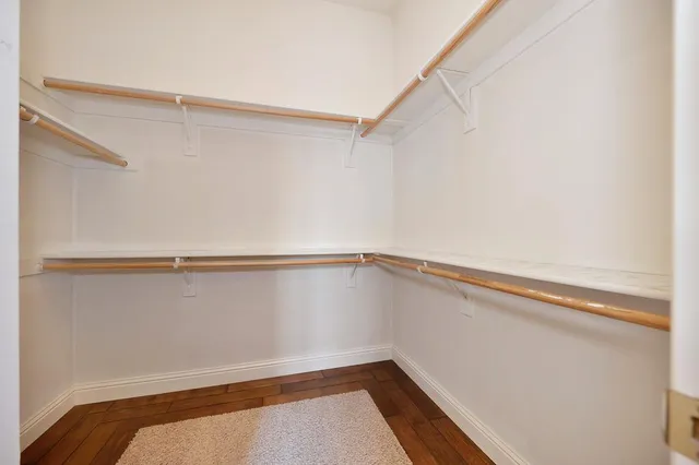 a view of an empty room with a ceiling fan
