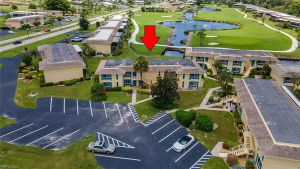 an aerial view of a house with a swimming pool yard and outdoor seating