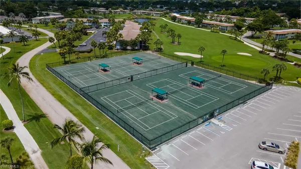 an aerial view of a house with a garden and lake view