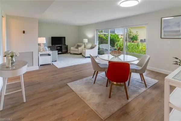 a view of a dining room with furniture window and outside view