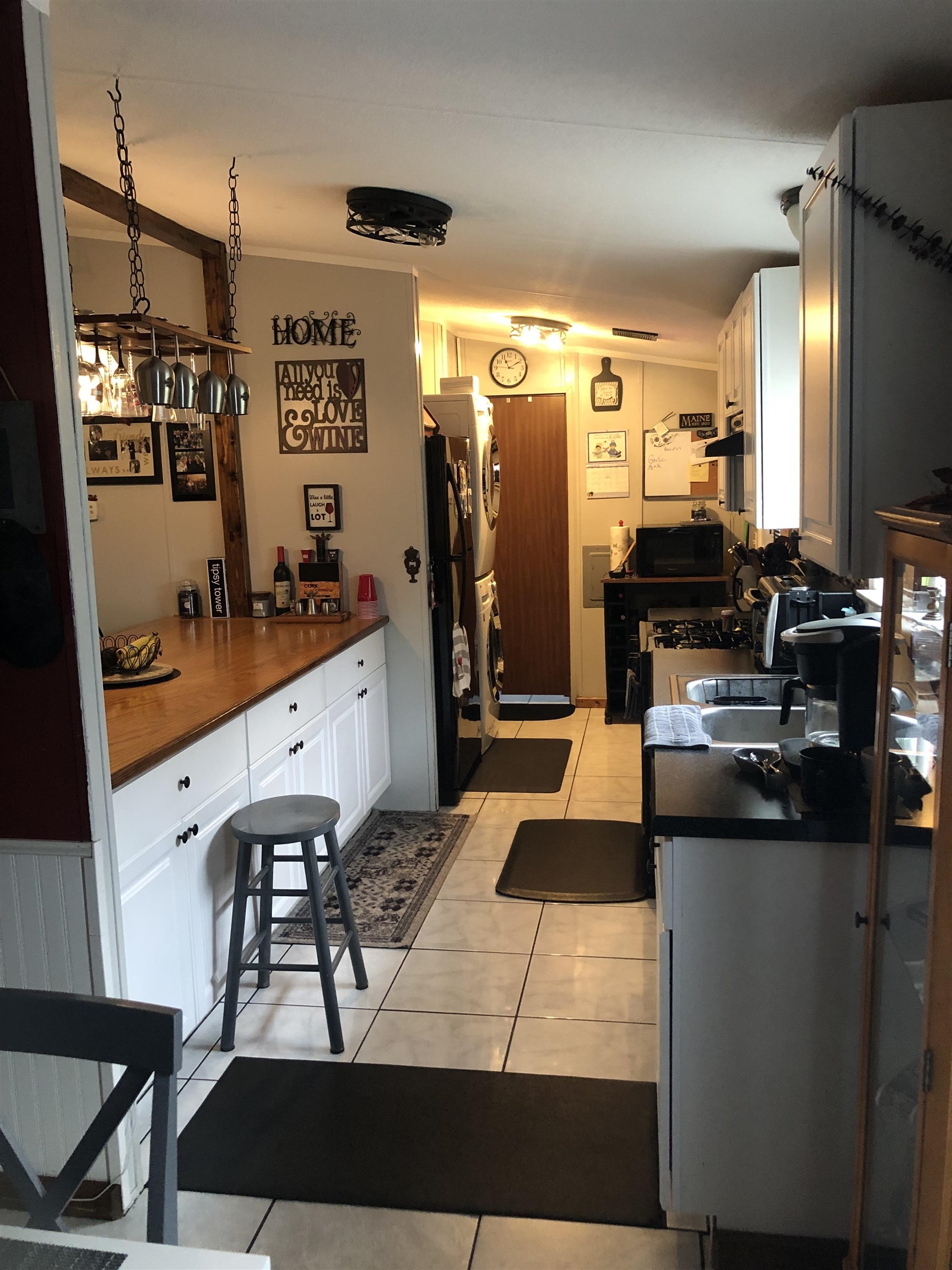 3180 Green Acres Road St. Augustine, FL 32084 - Photo 12 of 24 a large kitchen with stainless steel appliances kitchen island granite countertop a sink and cabinets