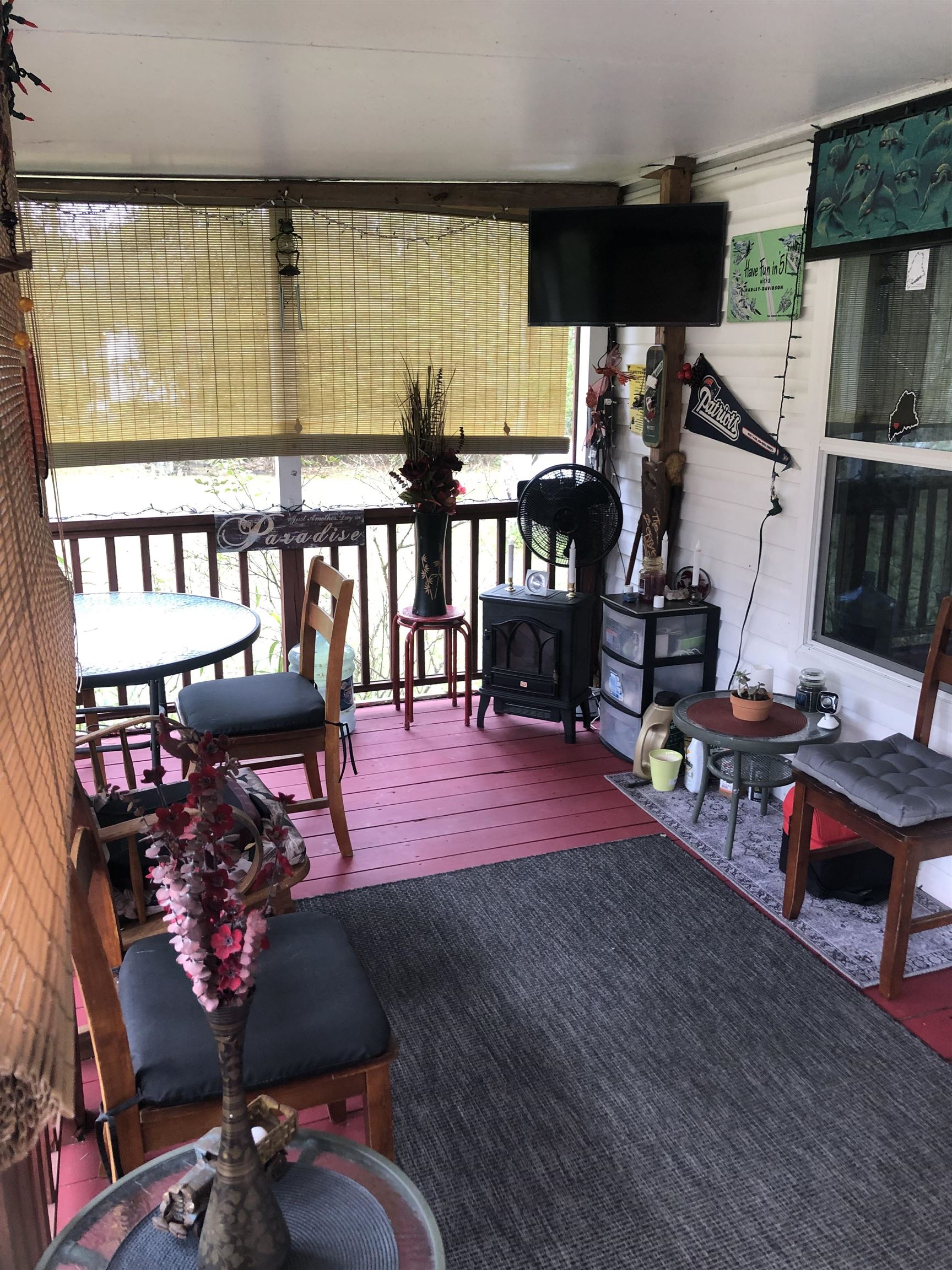 3180 Green Acres Road St. Augustine, FL 32084 - Photo 6 of 24 a living room with furniture a flat screen tv and a table
