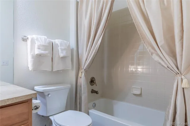 a bathroom with a sink vanity and a mirror