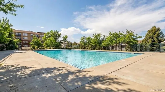 a view of a backyard with sitting area