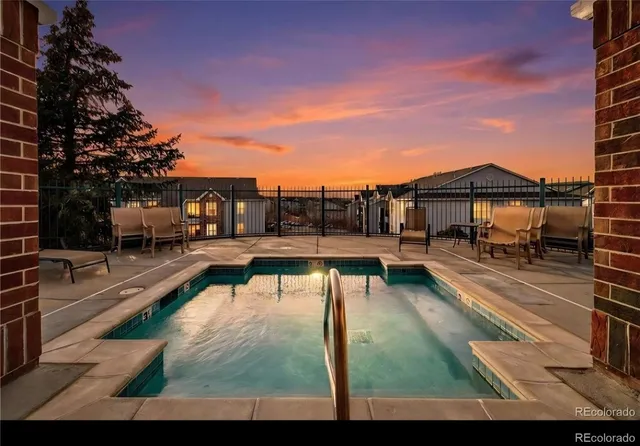 a view of a houses with a yard and car parked