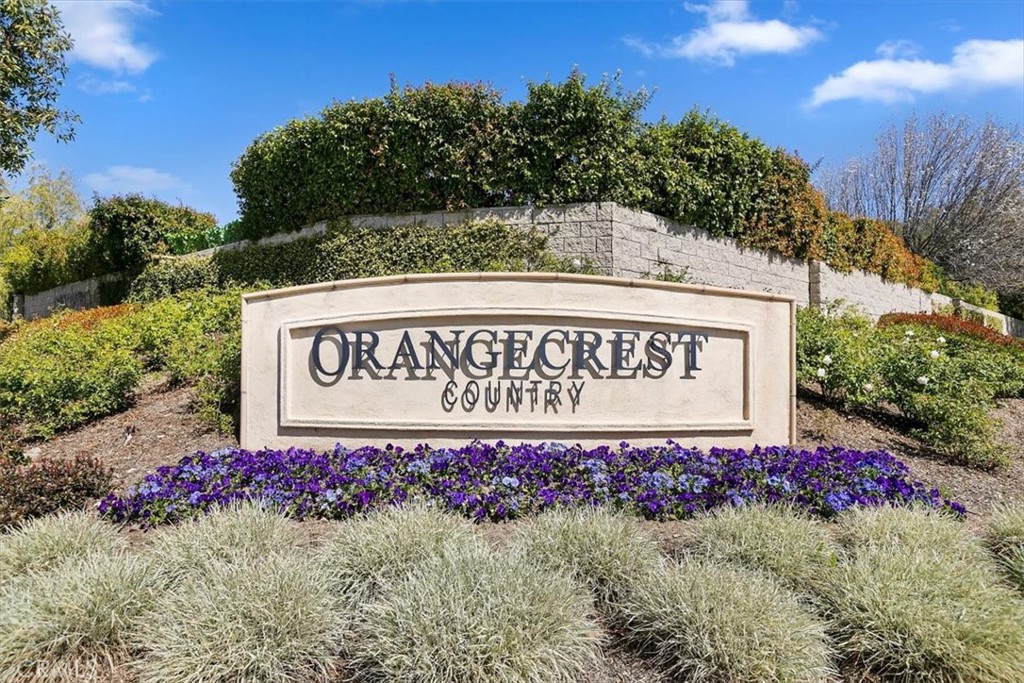 20664 Iris Canyon Road Riverside, CA 92508 - Photo 2 of 4 a sign that is sitting in front of flowers