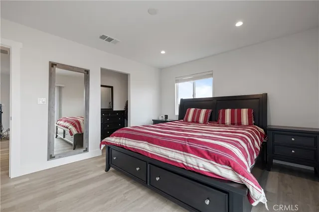 a bathroom with a sink vanity granite and shower