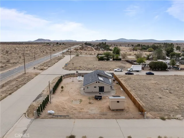 an aerial view of a house with beach