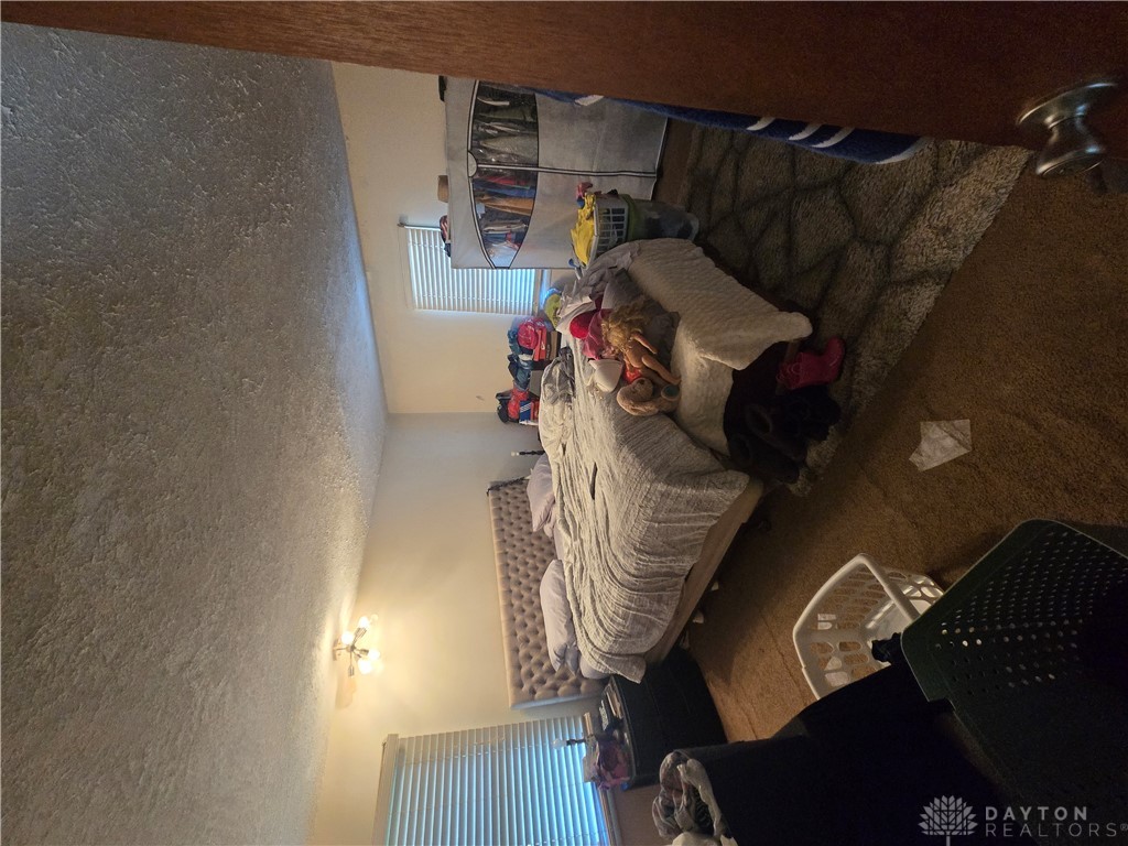 355 Elmhurst Road Dayton, OH 45417 - Photo 10 of 19 This spacious bedroom offers ample natural light and a comfortable atmosphere for rest and relaxation.