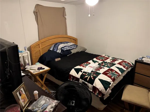 a bedroom with a bed and dresser