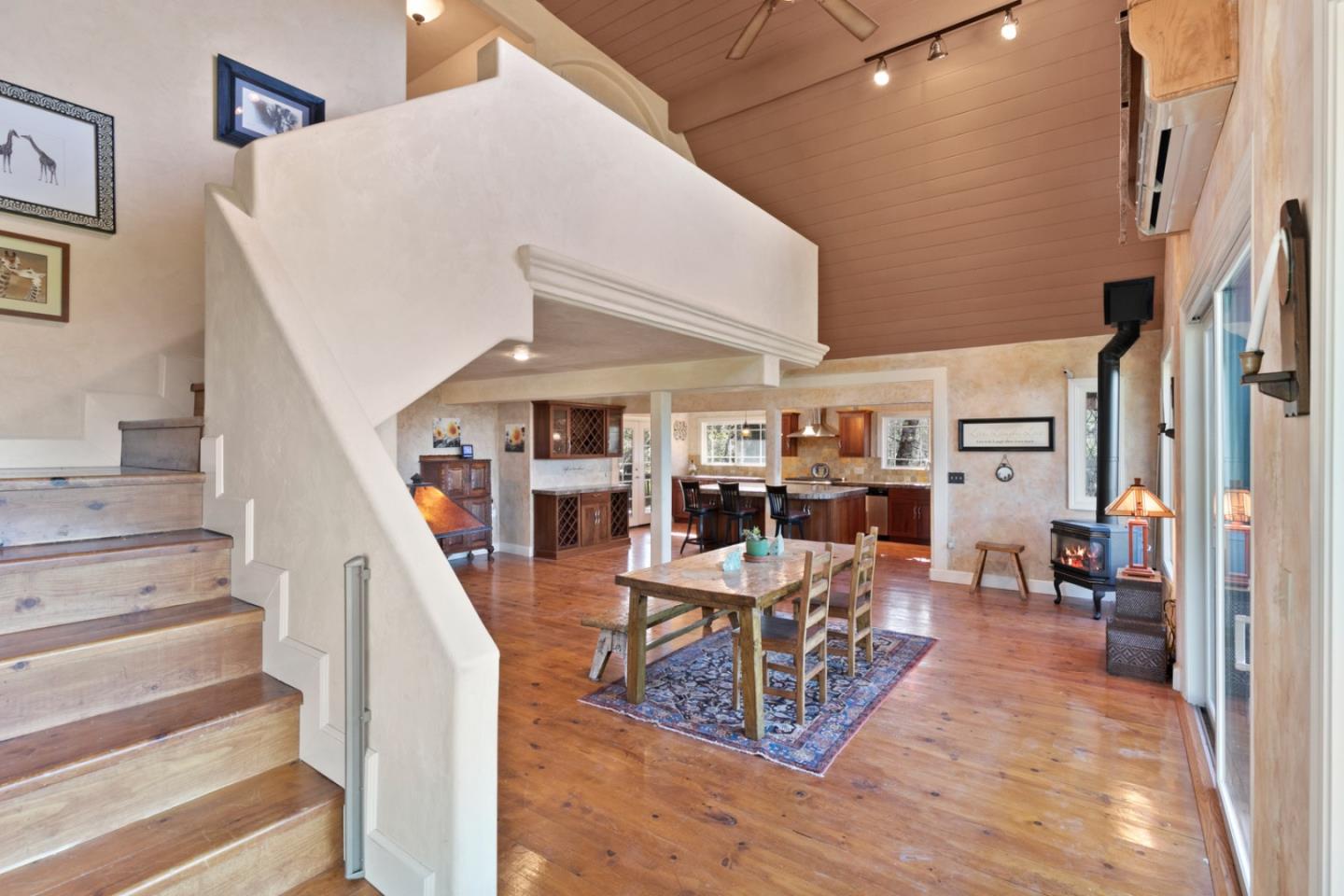 38025 Poppy Tree Lane Carmel Valley, CA 93924 - Photo 18 of 47 a living room with lots of furniture and a chandelier