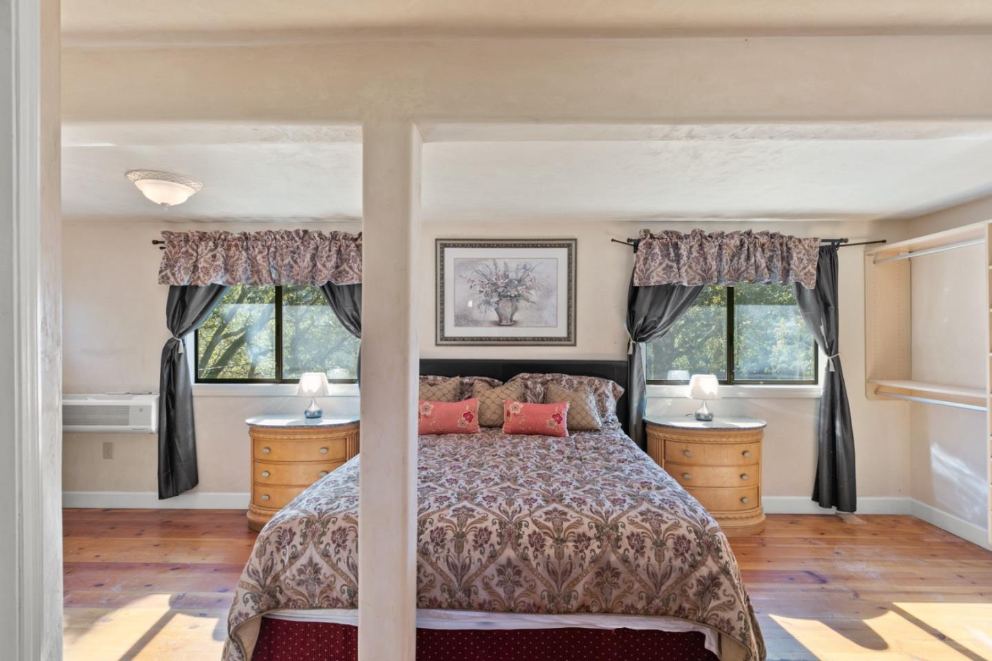 38025 Poppy Tree Lane Carmel Valley, CA 93924 - Photo 22 of 47 a bedroom with a bed and a large window
