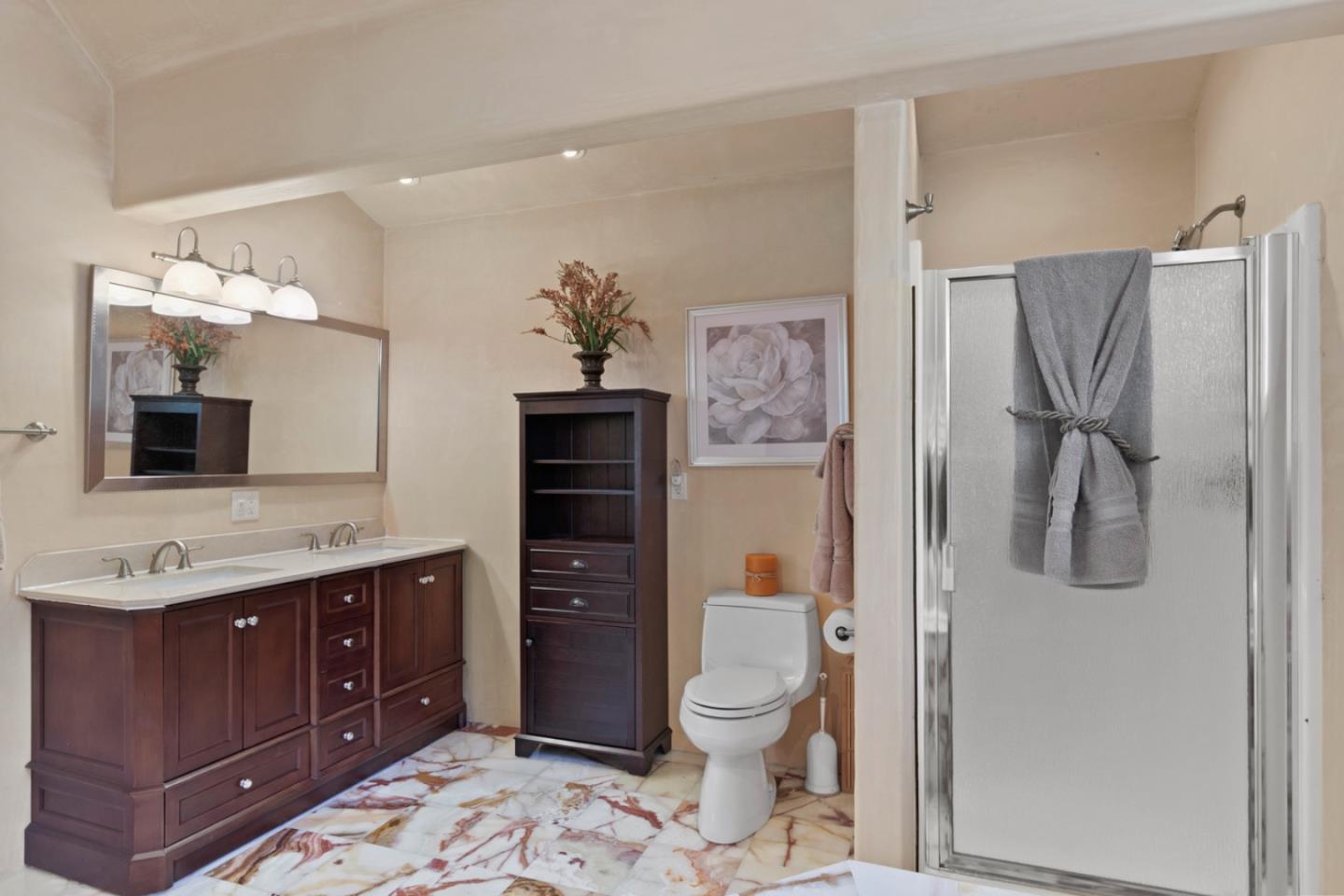 38025 Poppy Tree Lane Carmel Valley, CA 93924 - Photo 26 of 47 a bathroom with a toilet sink vanity granite and shower