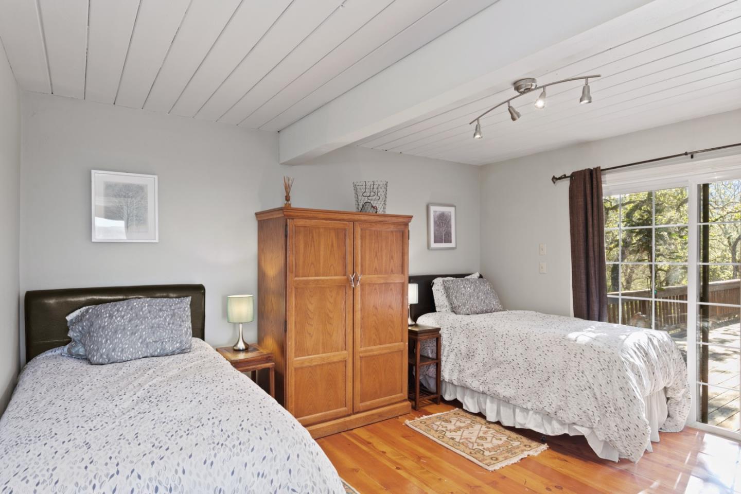 38025 Poppy Tree Lane Carmel Valley, CA 93924 - Photo 27 of 47 a bedroom with a bed and a window