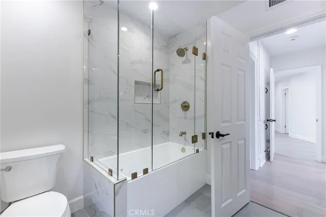 a view of a house with backyard porch and sitting area