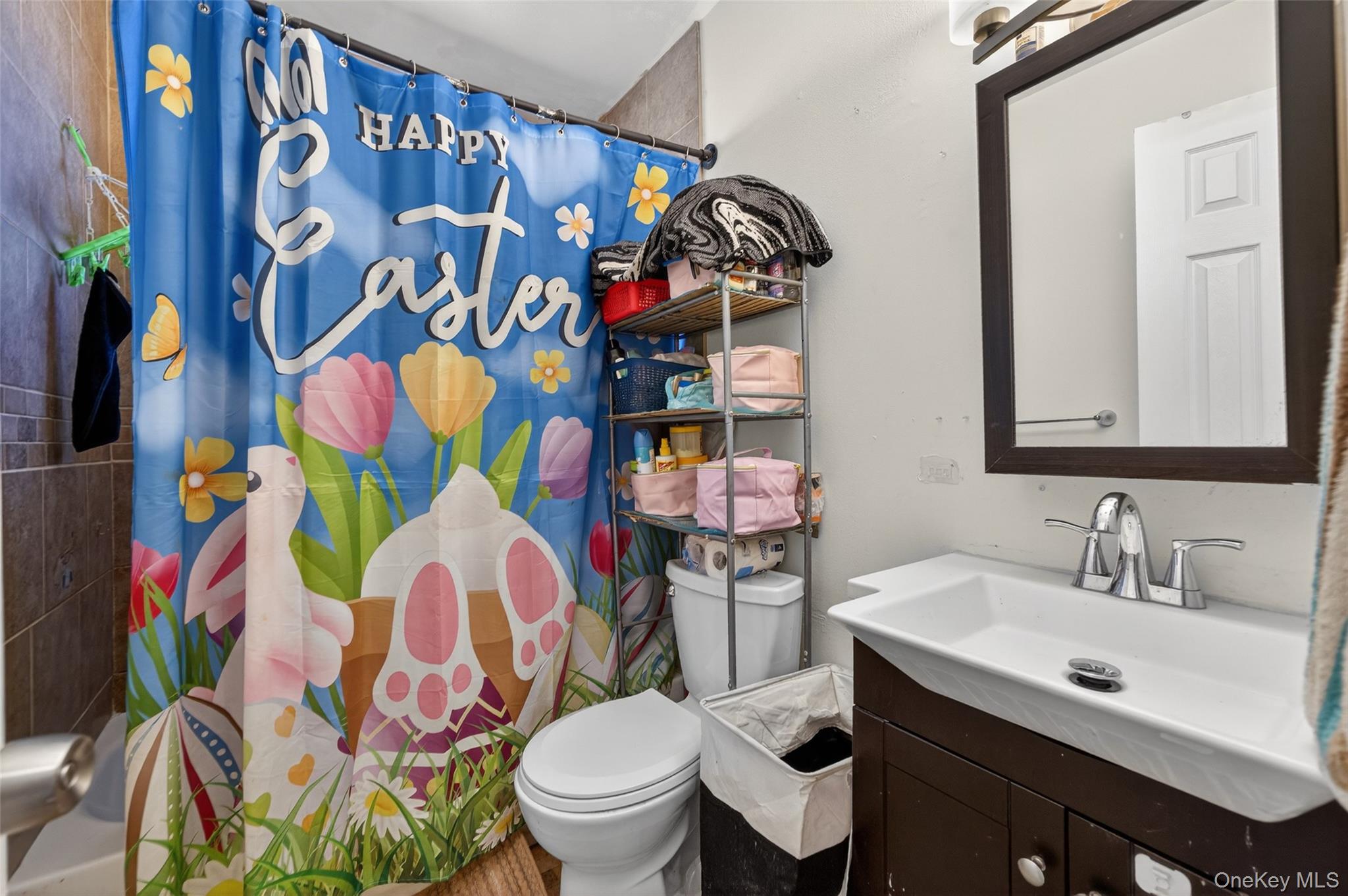 276 Temple Hill Road, Unit 2414 New Windsor, NY 12553 - Photo 18 of 29 a bathroom with a sink toilet and a mirror