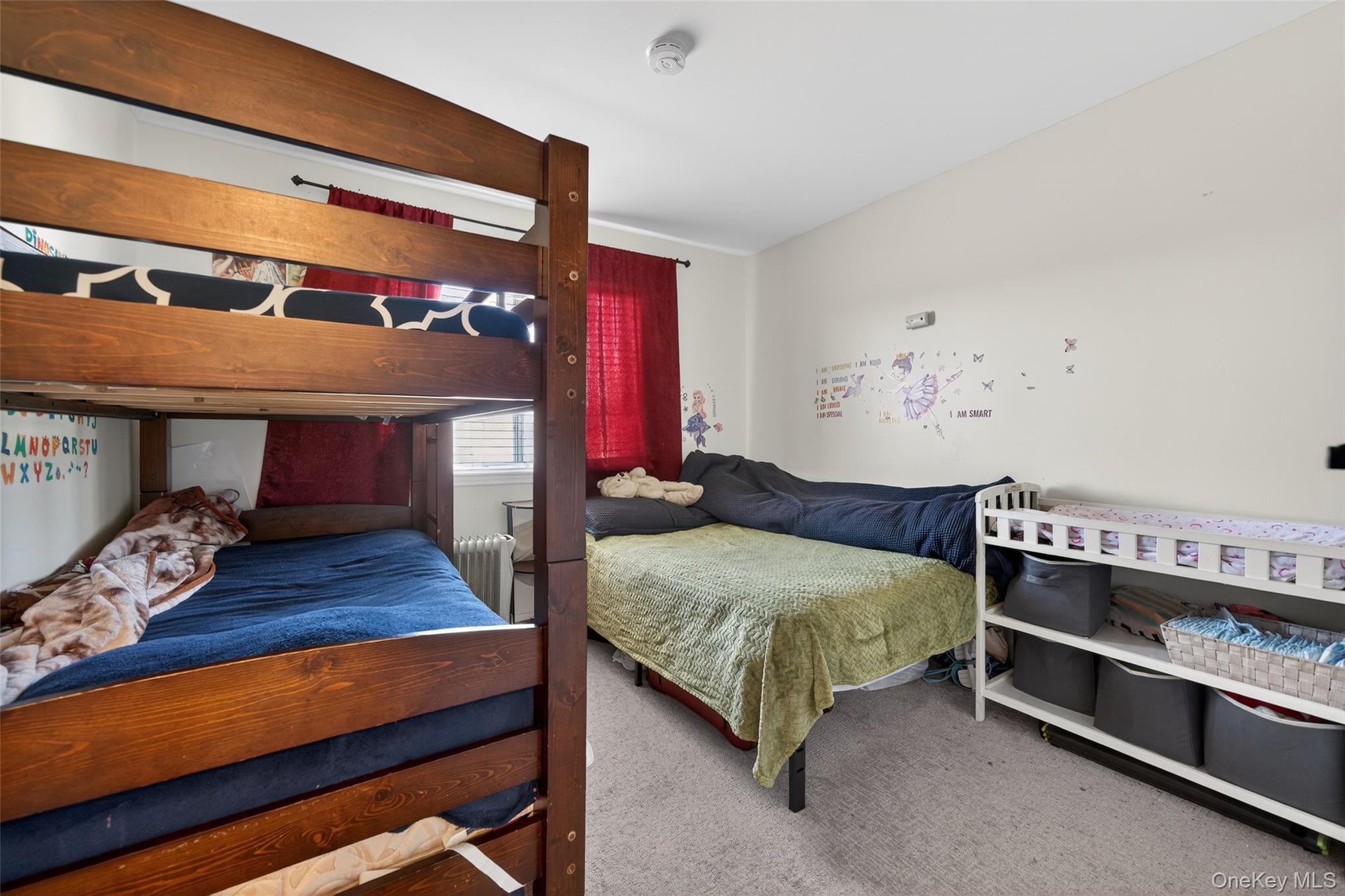 276 Temple Hill Road, Unit 2414 New Windsor, NY 12553 - Photo 19 of 29 a bedroom with a bed and a table
