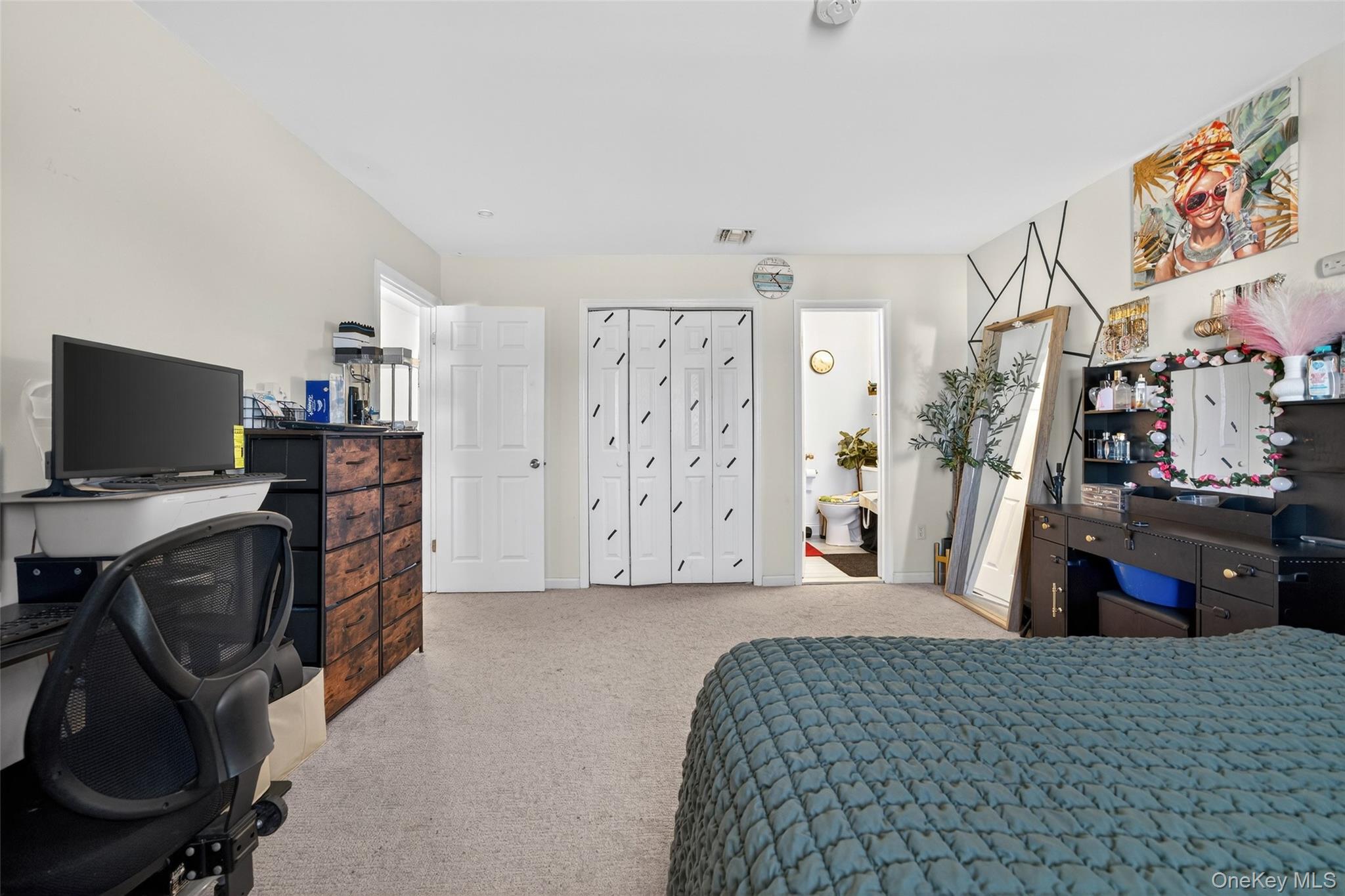 276 Temple Hill Road, Unit 2414 New Windsor, NY 12553 - Photo 23 of 29 a view of a bedroom with workspace and furniture
