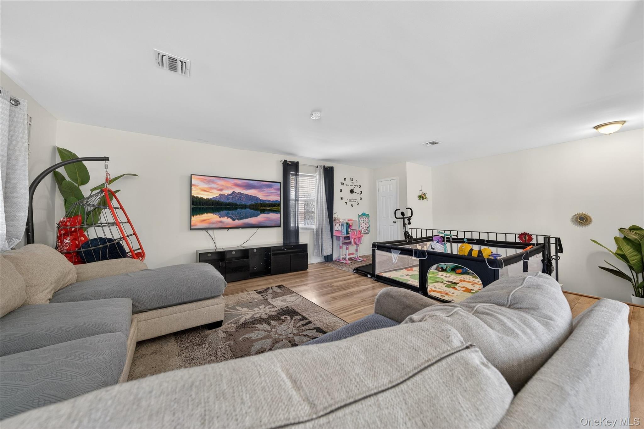 276 Temple Hill Road, Unit 2414 New Windsor, NY 12553 - Photo 7 of 29 a living room with furniture and a flat screen tv