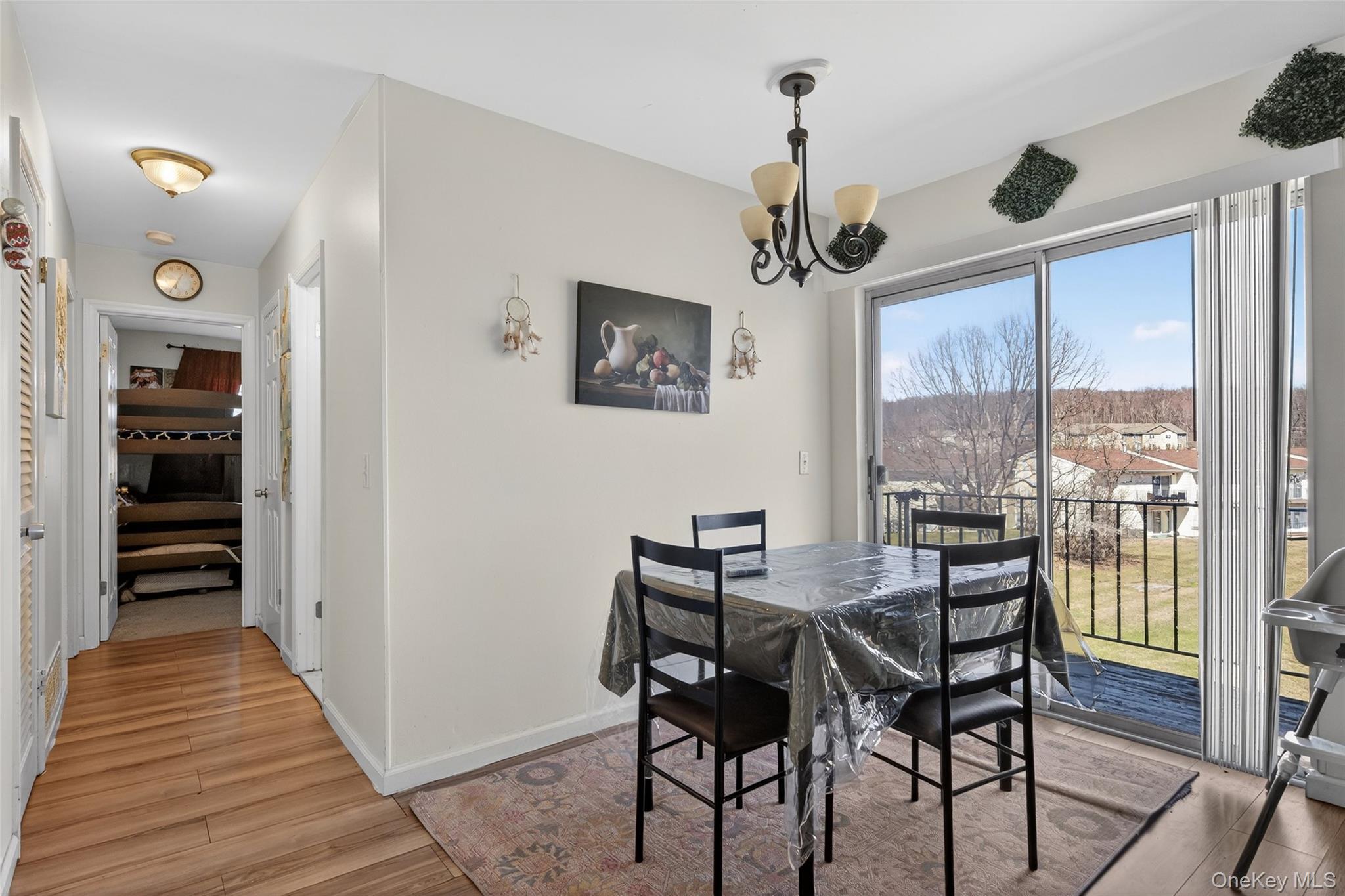276 Temple Hill Road, Unit 2414 New Windsor, NY 12553 - Photo 10 of 29 a view of a dining room with furniture window and wooden floor