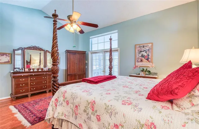 a bedroom with a bed and a dresser in it