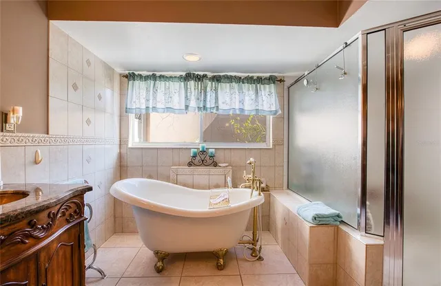 a spacious bathroom with a double vanity sink and a mirror
