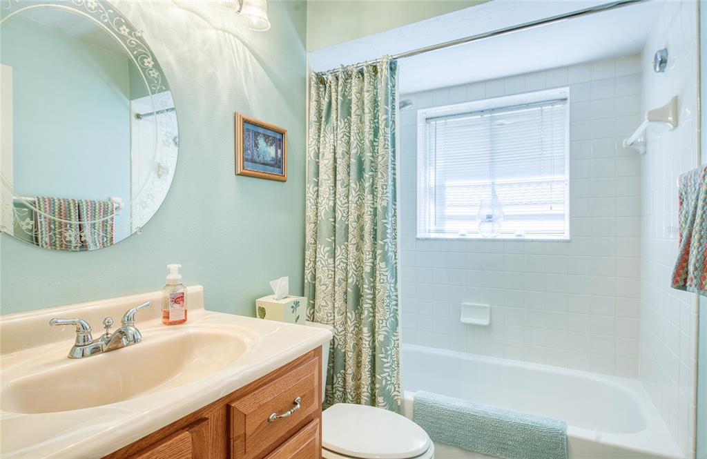 4901 Hallstead Way Tampa, FL 33647 - Photo 32 of 47 a bathroom with a sink toilet and shower