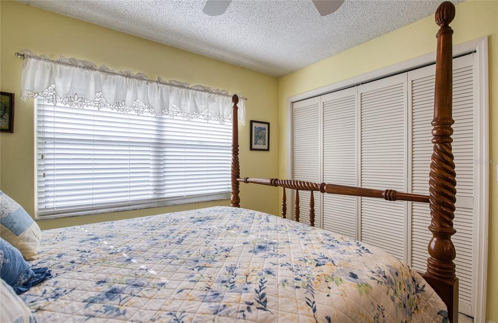 4901 Hallstead Way Tampa, FL 33647 - Photo 34 of 47 a view of a bedroom with a balcony a bed and a window