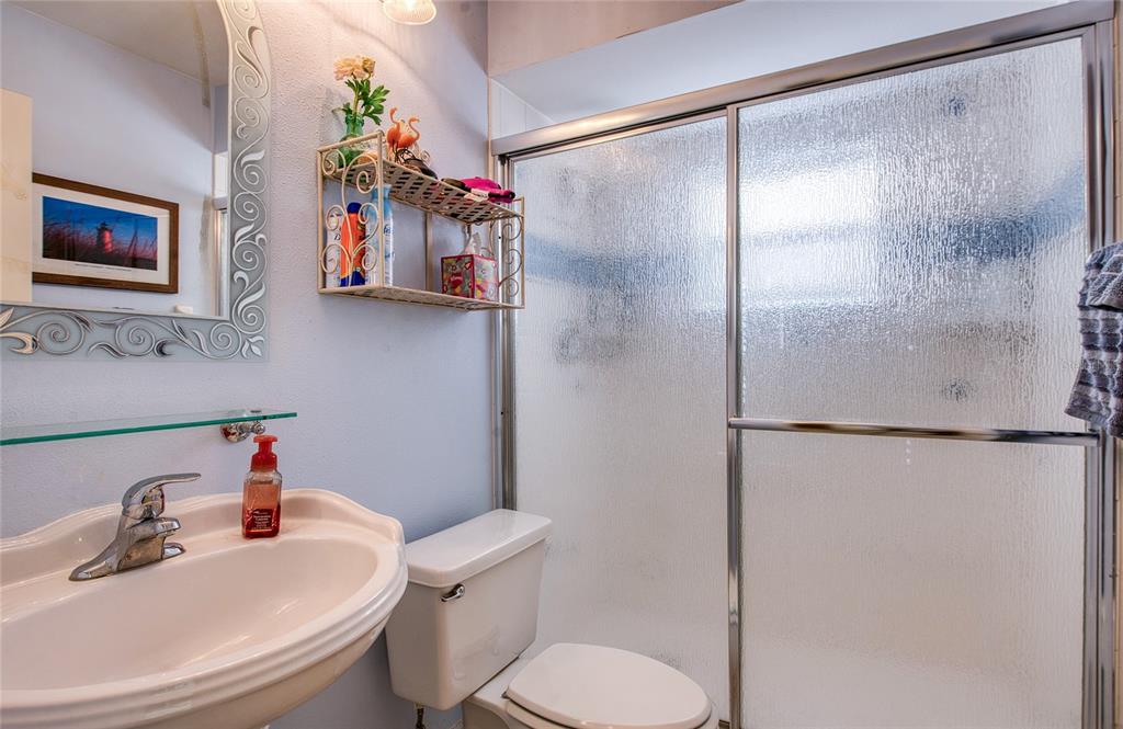 4901 Hallstead Way Tampa, FL 33647 - Photo 35 of 47 a bathroom with a sink toilet and shower
