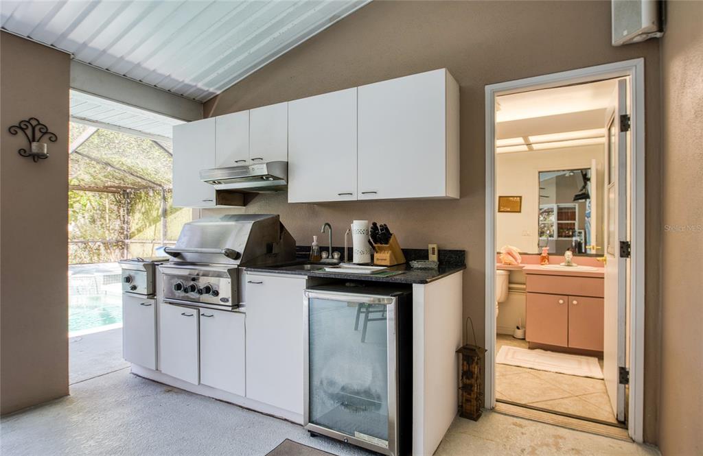 4901 Hallstead Way Tampa, FL 33647 - Photo 40 of 47 a kitchen with stainless steel appliances granite countertop a stove and a refrigerator
