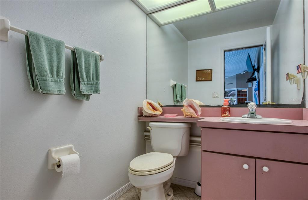 4901 Hallstead Way Tampa, FL 33647 - Photo 41 of 47 a bathroom with a toilet sink and mirror