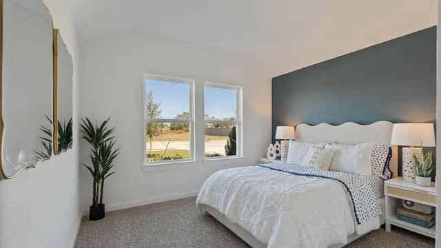 a bedroom with bed and window