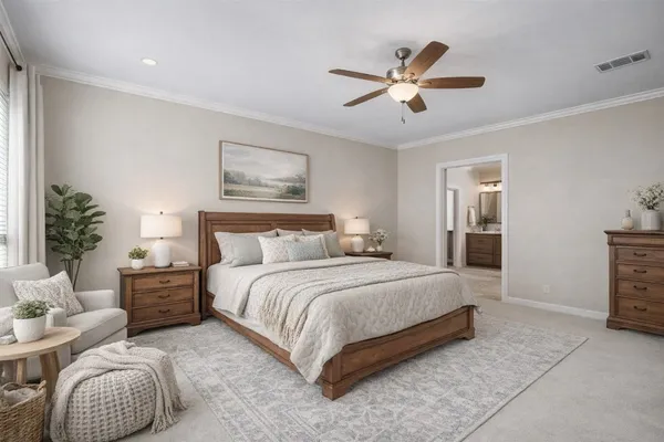 a spacious bedroom with a bed and a chandelier