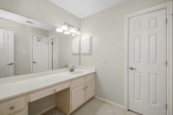 a spacious bathroom with a double vanity sink mirror and