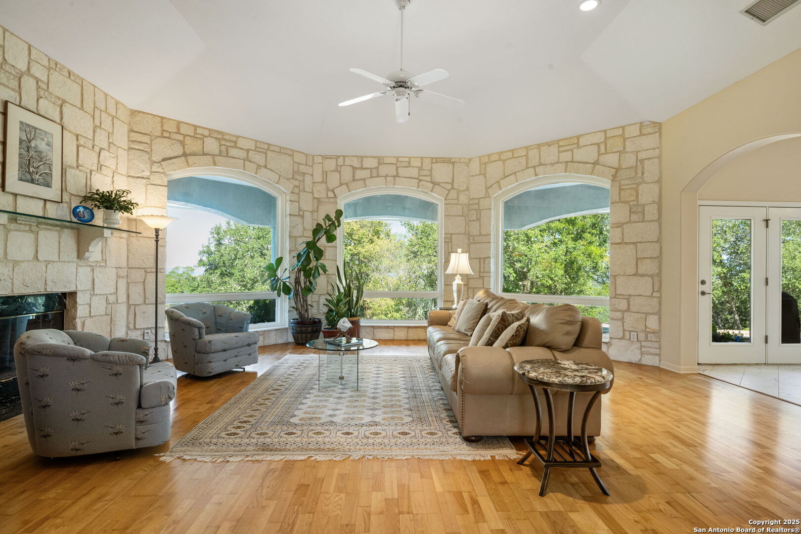 305 Spanish Pass Road Boerne, TX 78006 - Photo 16 of 105 a living room with furniture and a large window