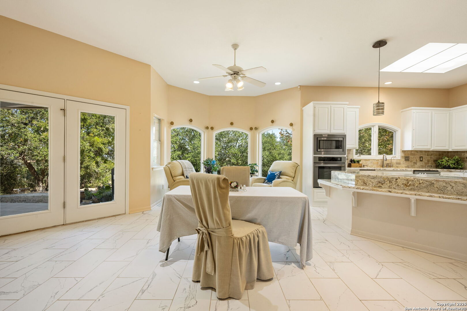 305 Spanish Pass Road Boerne, TX 78006 - Photo 18 of 105 a living room with a large window and chandelier
