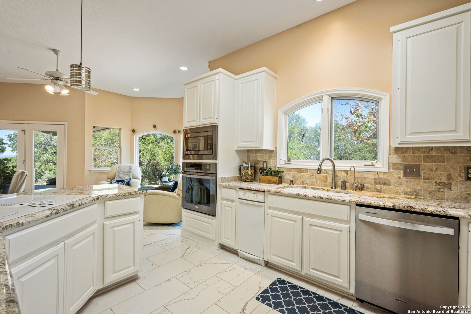 305 Spanish Pass Road Boerne, TX 78006 - Photo 20 of 105 a kitchen with a sink stove and window