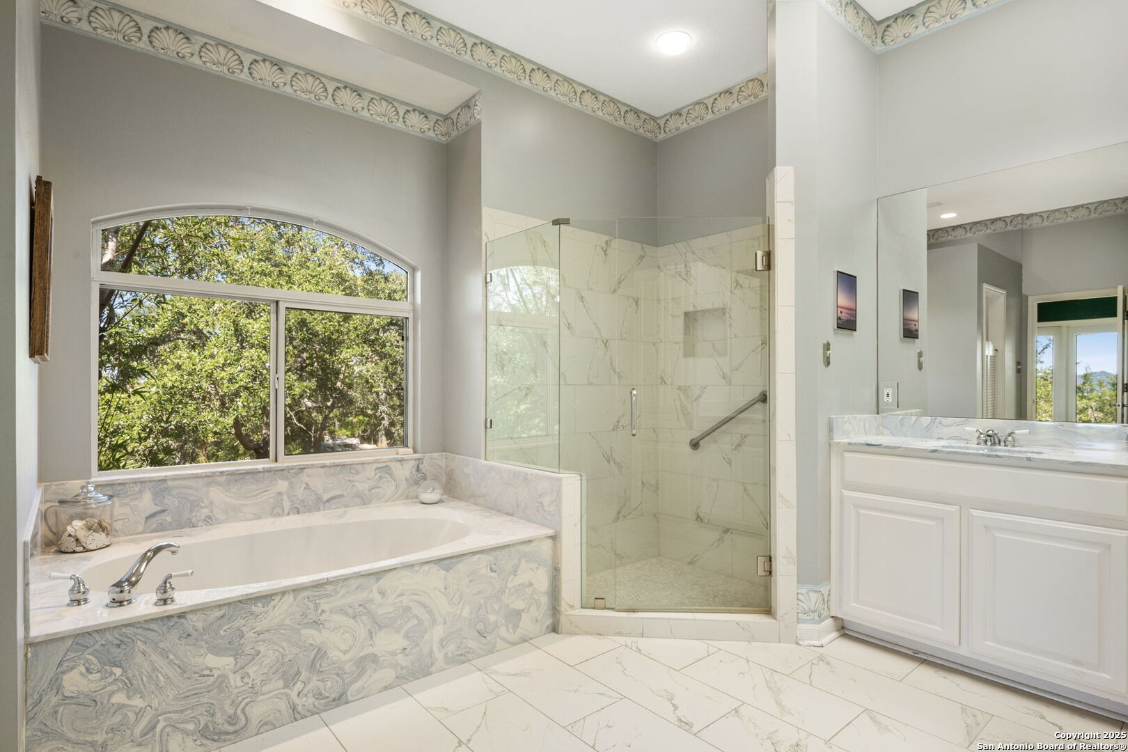 305 Spanish Pass Road Boerne, TX 78006 - Photo 24 of 105 a spacious bathroom with a granite countertop bathtub shower and sink