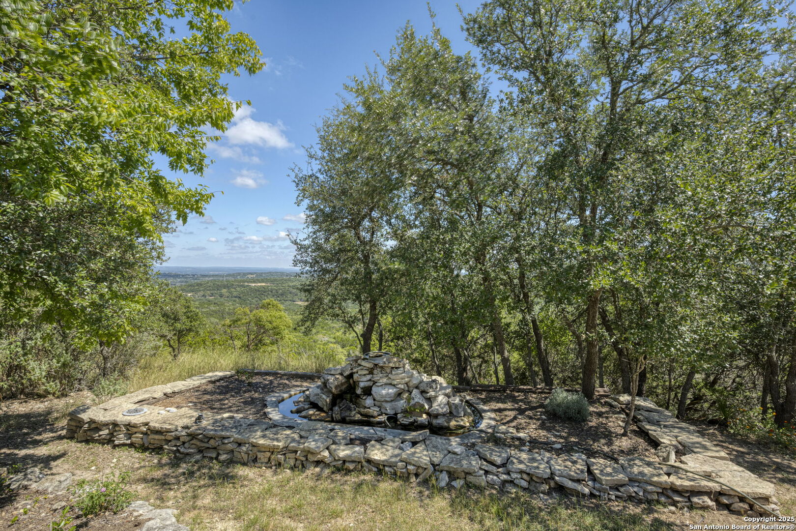 305 Spanish Pass Road Boerne, TX 78006 - Photo 41 of 105 a big yard with lots of green space