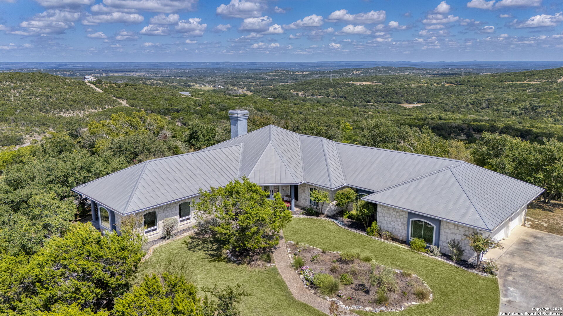 305 Spanish Pass Road Boerne, TX 78006 - Photo 5 of 105 an aerial view of a house with a garden