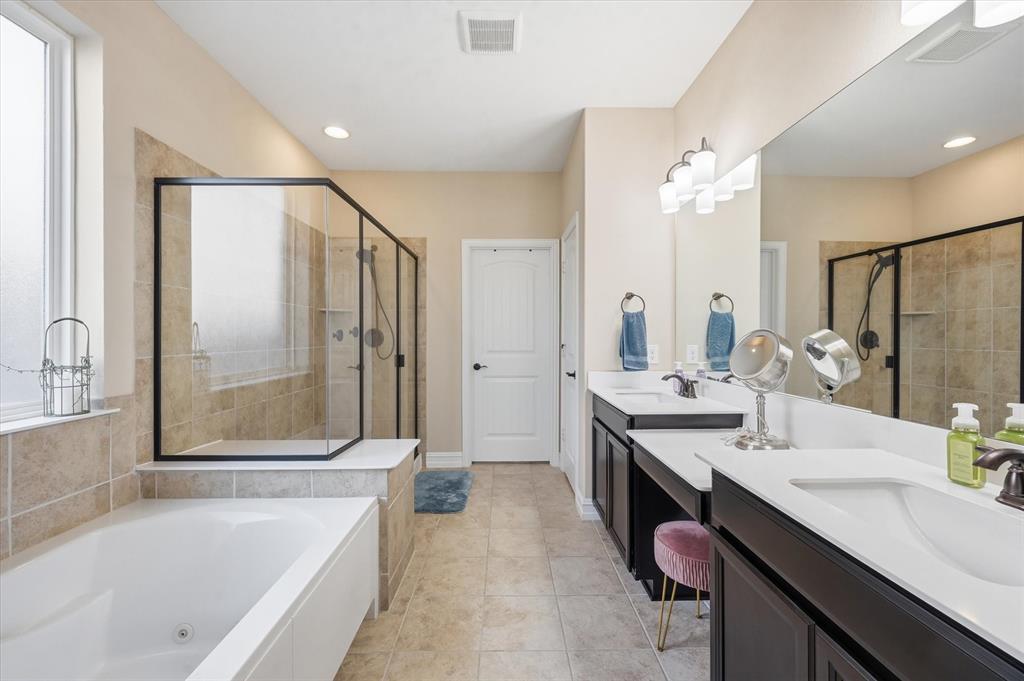 824 Pinnacle Ridge Road Fort Worth, TX 76052 - Photo 29 of 40 a bathroom with a granite countertop sink mirror bathtub and shower