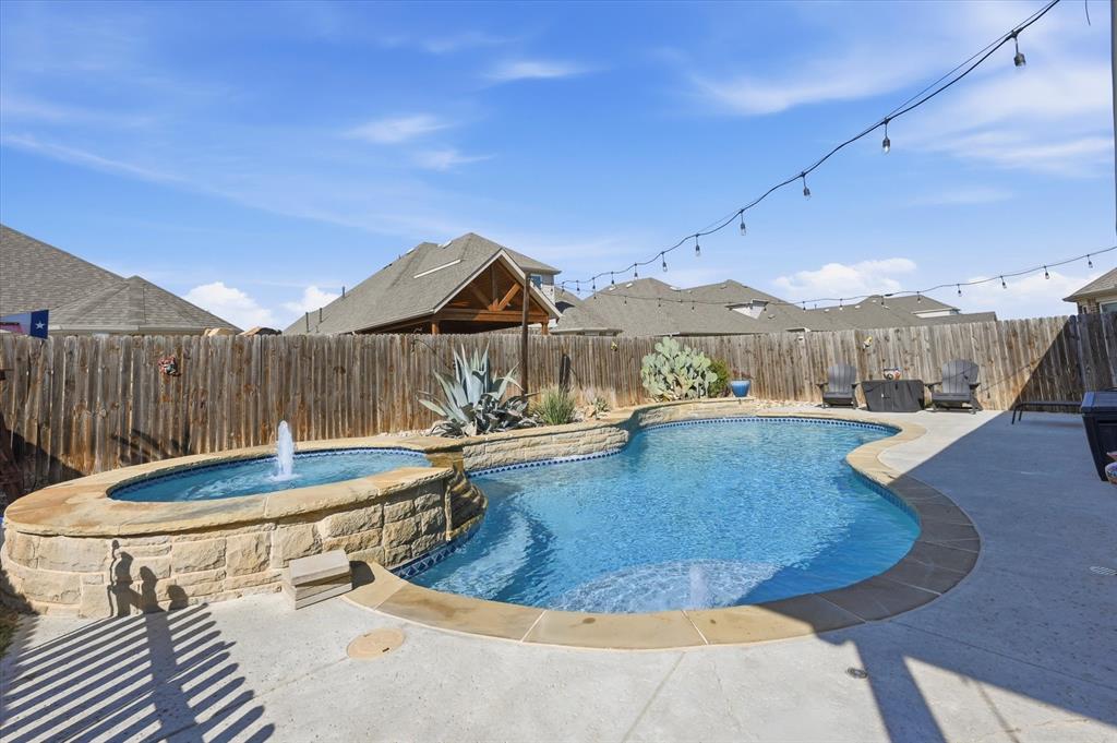 824 Pinnacle Ridge Road Fort Worth, TX 76052 - Photo 3 of 40 a view of a house with swimming pool