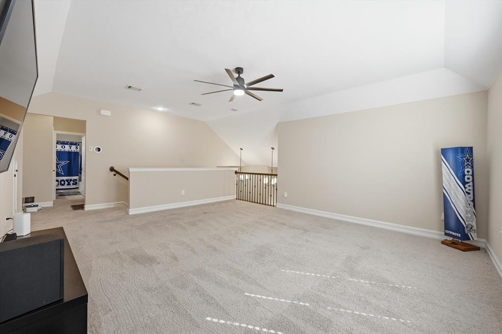824 Pinnacle Ridge Road Fort Worth, TX 76052 - Photo 33 of 40 a view of a big room with chandelier fan and windows